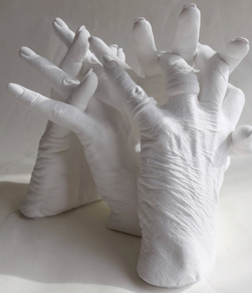 Handabformung von Mutter und Tochter